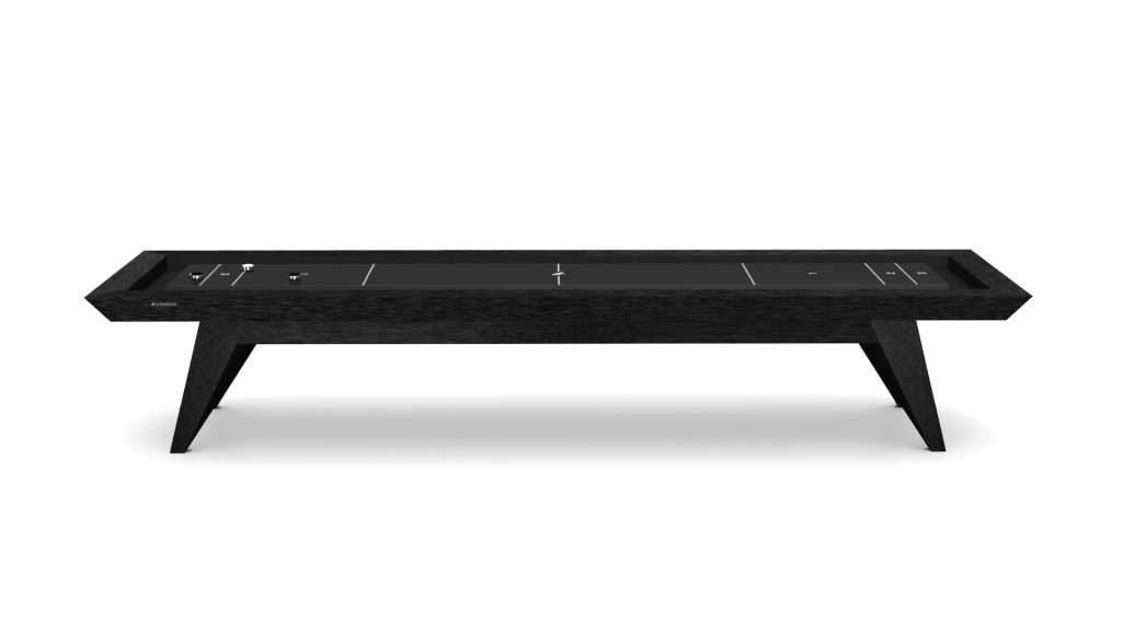 The Trigon Shuffleboard Table features a sleek, modern design in black with a minimalist aesthetic. It includes a smooth playing surface and sturdy legs, set in a bright, neutral space to highlight its elegant and streamlined appearance.