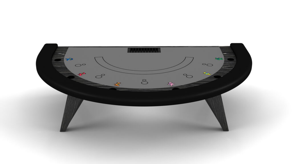 A top view of the Trigon Blackjack Table shows its semi-circular shape, gray playing surface, black padded edge and legs, with colorful poker chips at multiple player positions.