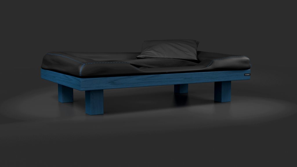 The Malibu Dog Bed offers a modern, minimalist design with a blue wooden frame and black mattress and pillow. Its sleek appearance against a dark gray background exudes elegance and comfort.