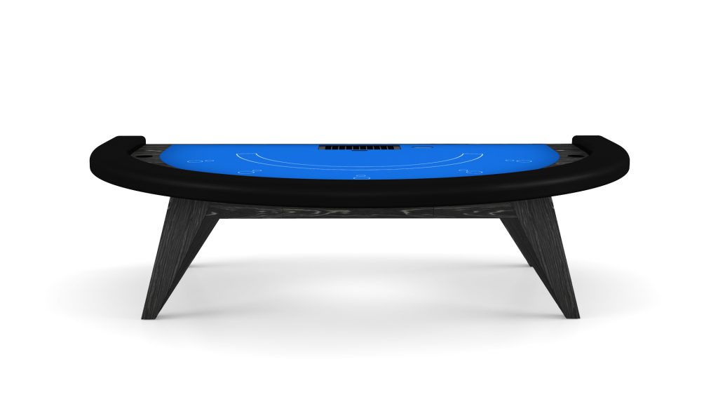 The Trigon Blackjack Table boasts a sleek, modern design with a black frame and vibrant blue playing surface. It features card positions, chip slots, and stands confidently on four angled legs.