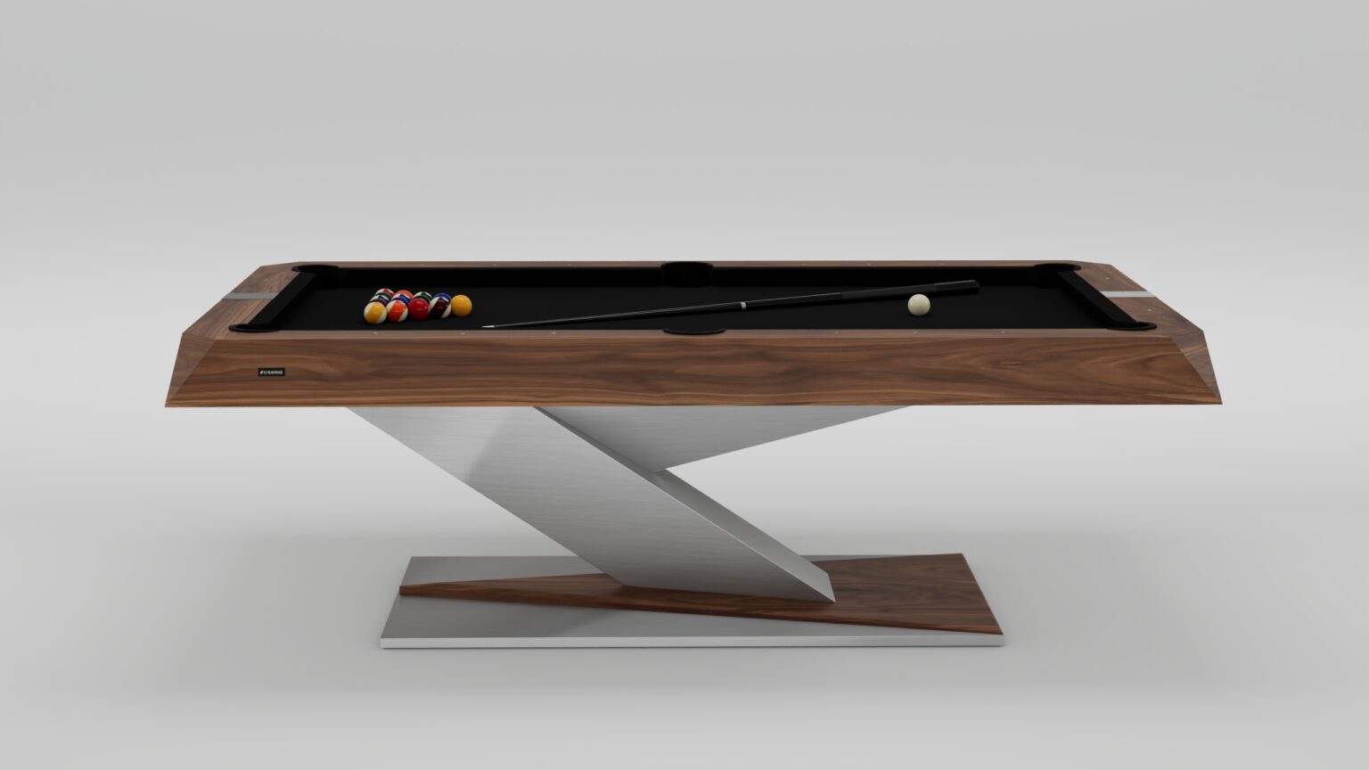 The Mitchell Pool Table features a sleek wooden top, black felt surface, and an angular metal base. It comes with a cue stick, cue ball, and a racked set of billiard balls arranged on the table.