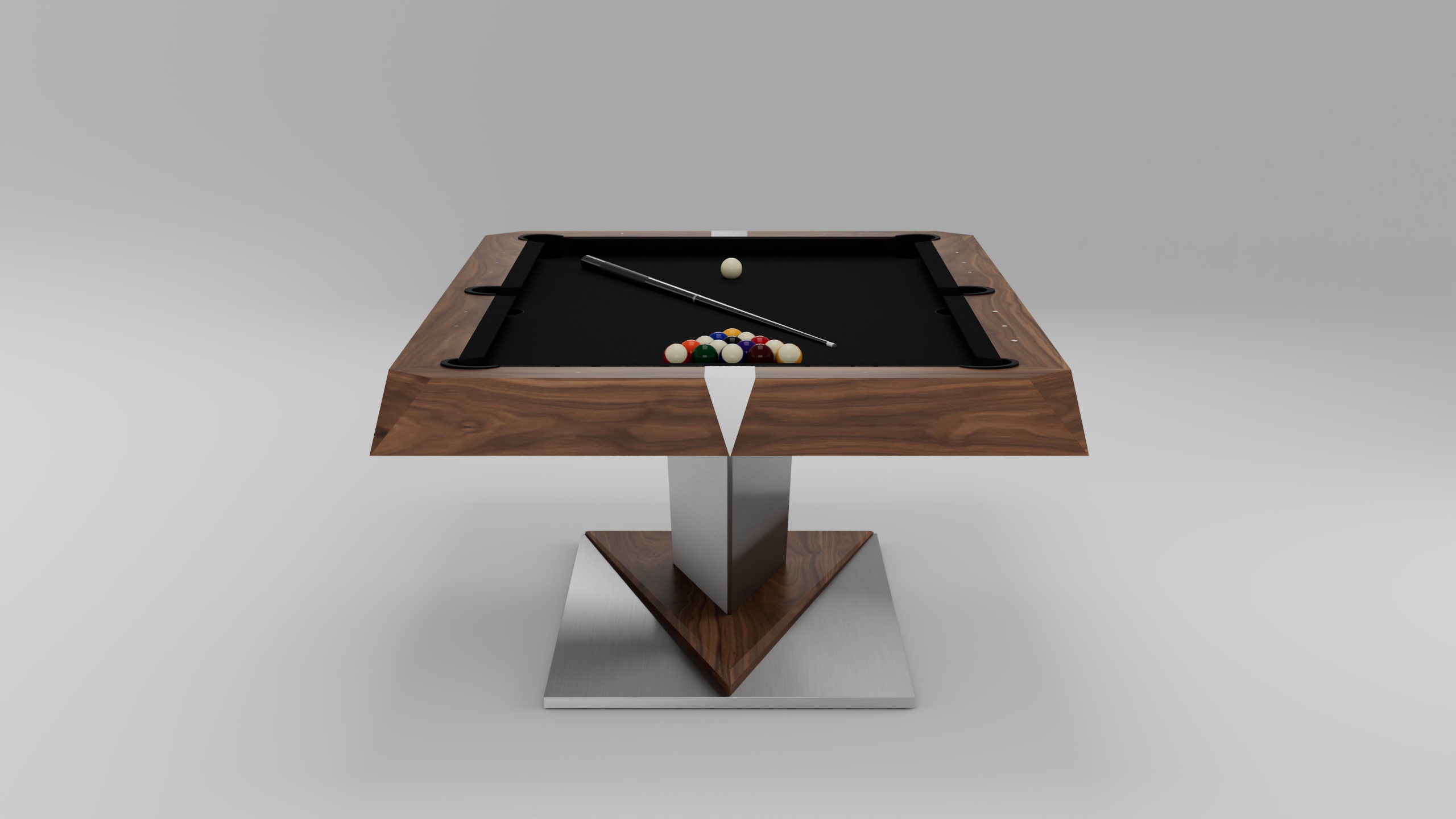 The Mitchell Pool Table features a sleek black playing surface, wooden edges, and a stainless-steel base. It comes with a cue stick, cue ball, and a triangle rack of colorful balls arranged for play.