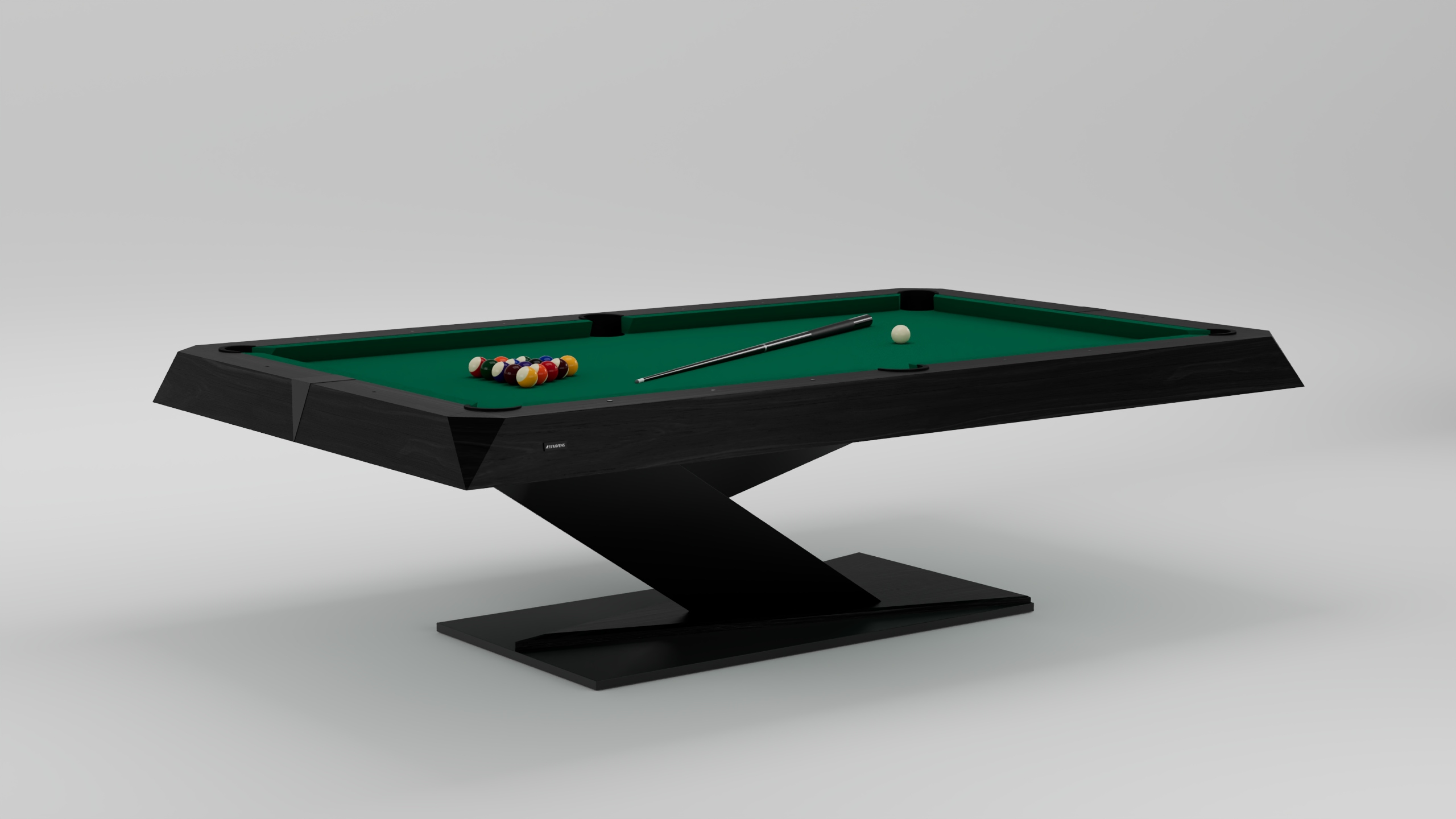 The Mitchell Pool Table showcases a modern black frame, green felt top, cue stick, white cue ball, and racked billiard balls on an angled pedestal base set against a light background.