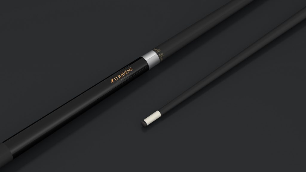 A close-up of a sleek 11R Pool Cue Stick, in black with a white tip and silver ring near the handle, features the brand RAVENS in gold lettering against a dark background, exuding elegance and craftsmanship.