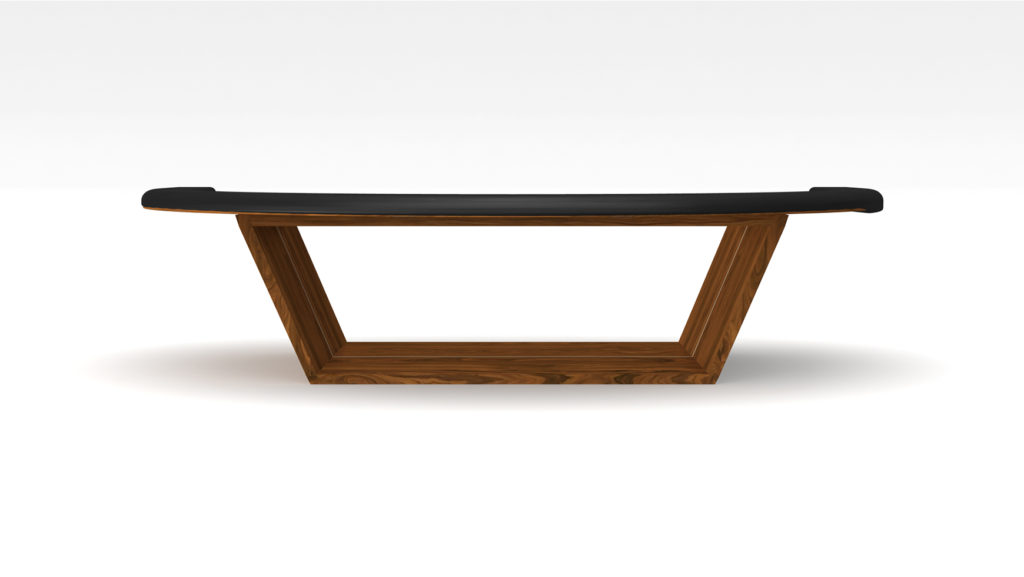 The Mesa Blackjack Table is a modern, minimalist wooden bench with a sleek black cushion on top. It has a geometric design akin to luxury mesas, featuring angled legs and a natural wood finish, set against a plain white background.