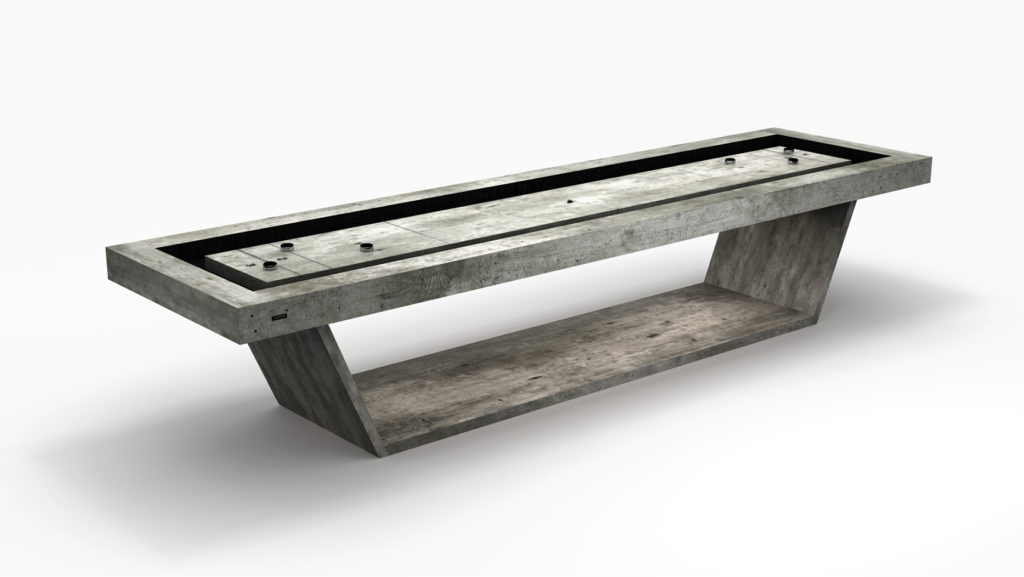 The Mesa Shuffleboard Table is a modern, minimalist concrete piece with an asymmetrical base and a long, narrow tabletop enhanced by built-in black slots. Its industrial design on a plain white background seamlessly blends elegance and functionality.