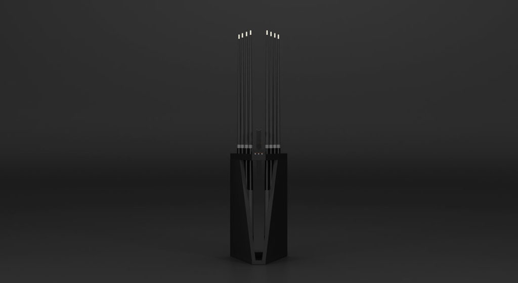 A tall, abstract sculpture with a black base and multiple vertical rods, reminiscent of the Spartan Cue Rack - Quick Ship, extends upwards against a dark background, casting subtle reflections.