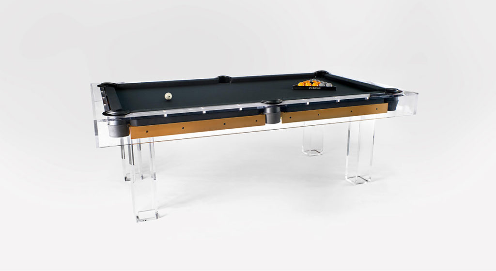 Presenting the Malibu Lucite Pool Table—a modern wonder with a transparent frame and legs, topped with sleek black felt, ready for your next game with a white cue ball and racked balls.