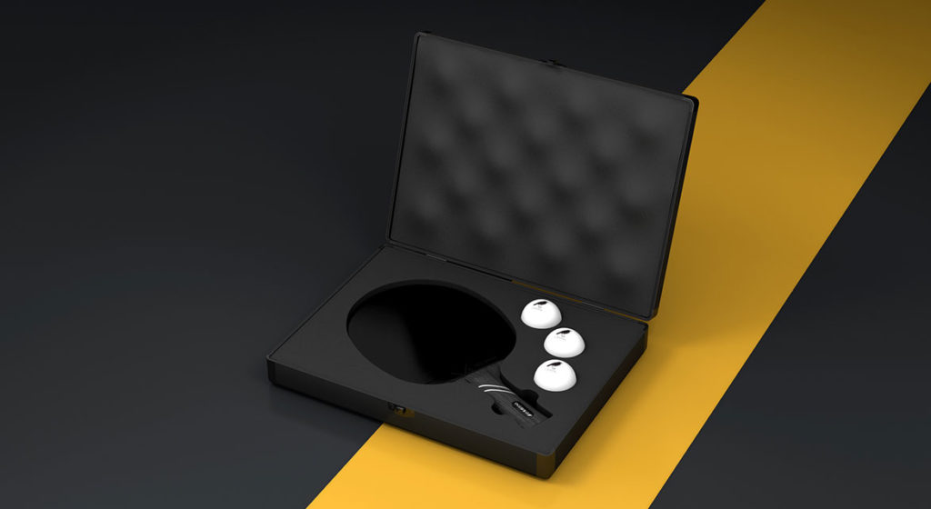 The Ping Pong Case, with its luxurious design like high-end game tables, features a foam interior that neatly holds a round black object, three white rounded items, and black and white glasses on a diagonal yellow stripe in an open black briefcase.