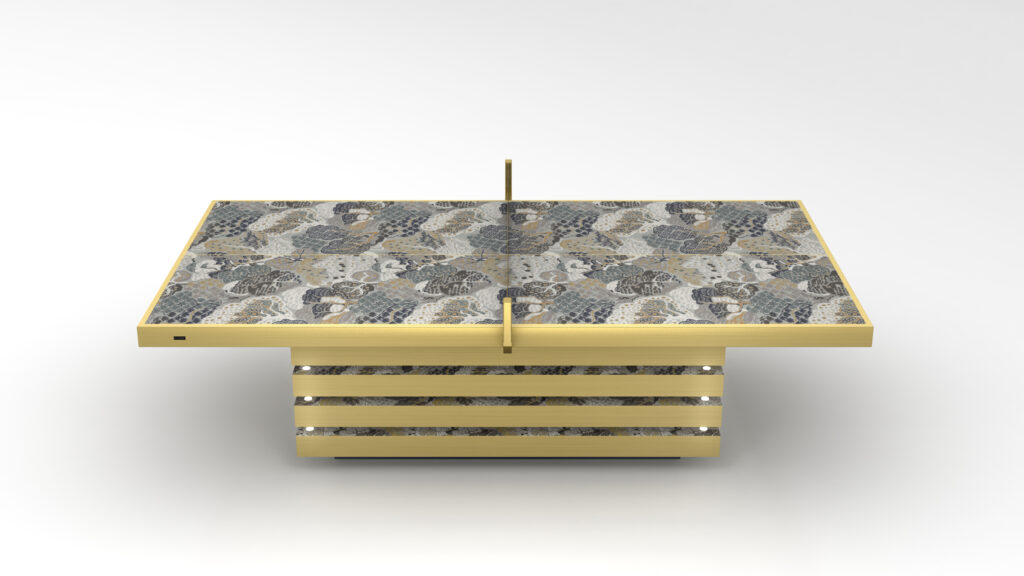 The Arclight Printed Table features a rectangular top with gray, blue, and beige abstract patterns. Its base has horizontal gold layers for a modern geometric look, resembling elegant game tables. It rests elegantly on a smooth, white surface.