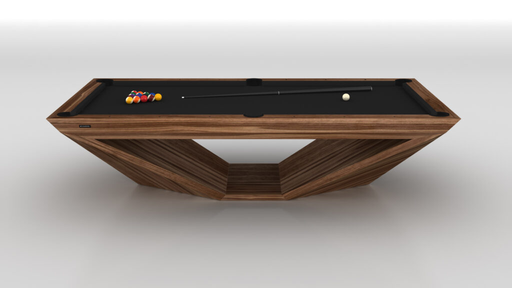 The Stealth Pool Table is a luxury game piece featuring a modern wooden geometric frame and sleek black surface. A triangle rack with pool balls sits on the left, alongside a cue and white ball, all against a plain white backdrop that accentuates its elegance.