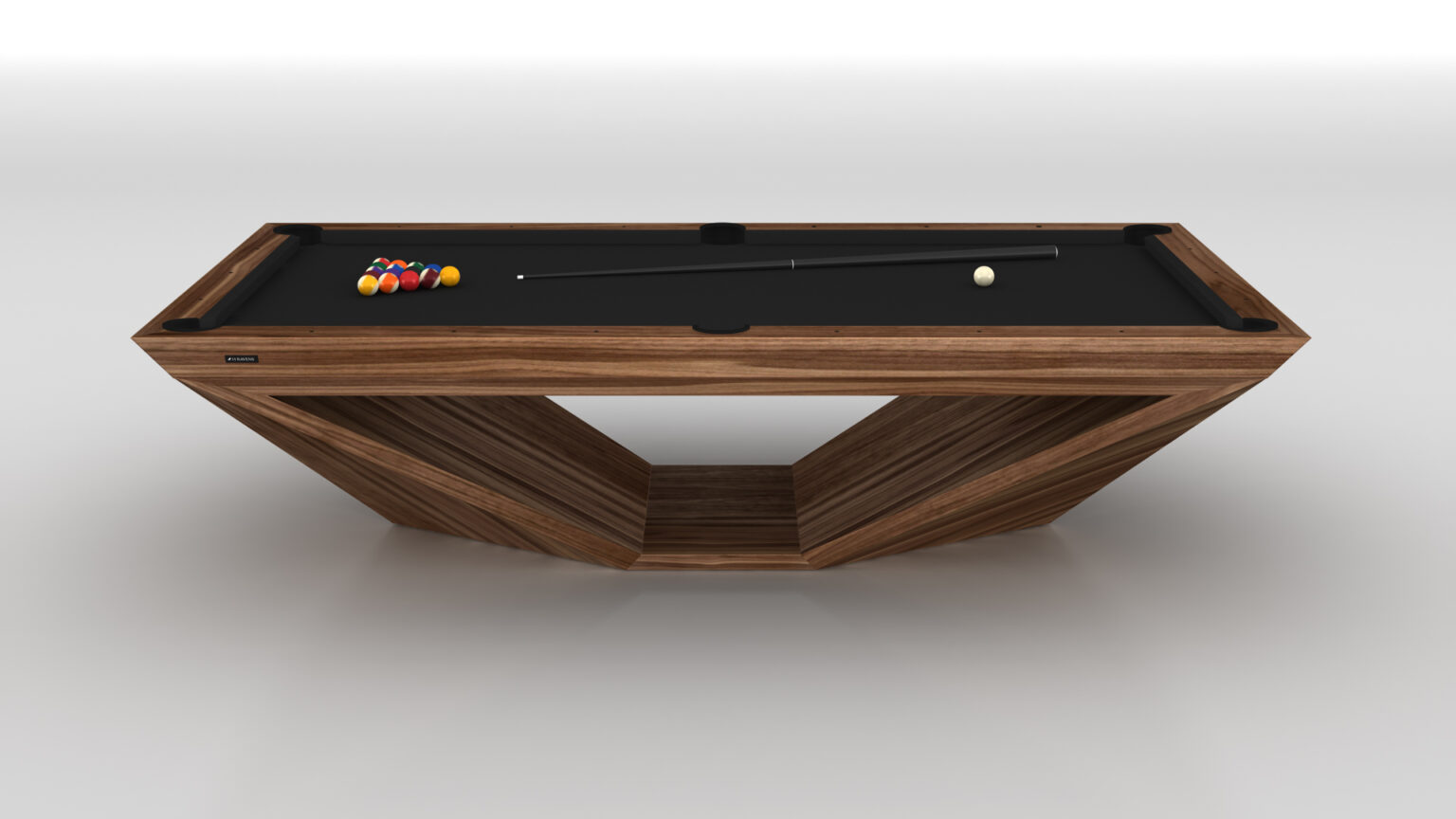 The Stealth Pool Table is a luxury game piece featuring a modern wooden geometric frame and sleek black surface. A triangle rack with pool balls sits on the left, alongside a cue and white ball, all against a plain white backdrop that accentuates its elegance.