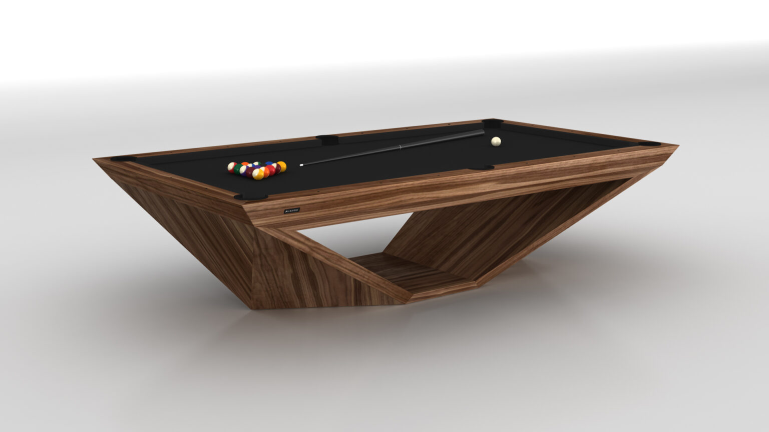 The Stealth Pool Table features a contemporary luxury design with a sleek wooden geometric base and a black felt top. Complete with cue and racked colorful balls, it complements the bright, minimalist room decor.