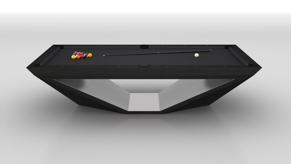 The Stealth Pool Table, featuring a modern angular design with a sleek black surface and geometric base, epitomizes luxury game tables. A cue stick, white cue ball, and triangle of colored balls are neatly arranged on the table against a minimalistic white background.