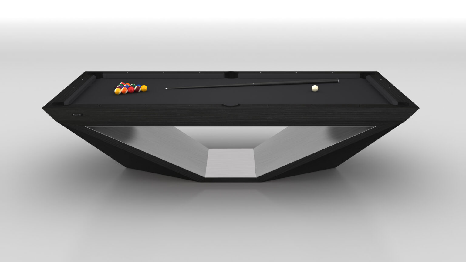 The Stealth Pool Table, featuring a modern angular design with a sleek black surface and geometric base, epitomizes luxury game tables. A cue stick, white cue ball, and triangle of colored balls are neatly arranged on the table against a minimalistic white background.