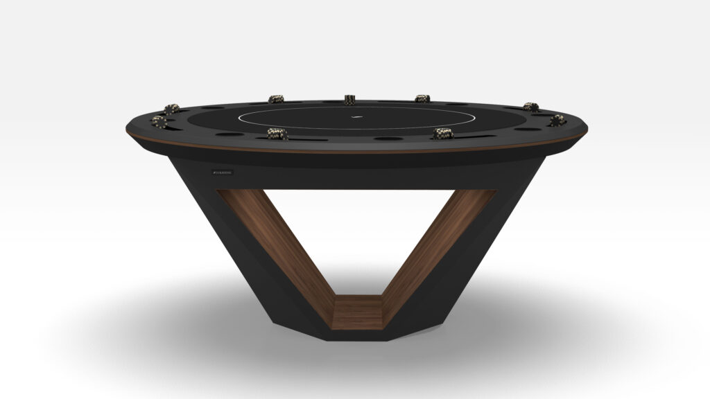 The Stealth Round Poker Table features a modern, sleek black circular top with a unique V-shaped wooden base. It includes dice and cup holders around the edge. The tabletop has a matte finish with minimalistic design elements on a plain white background, embodying luxury game table elegance.