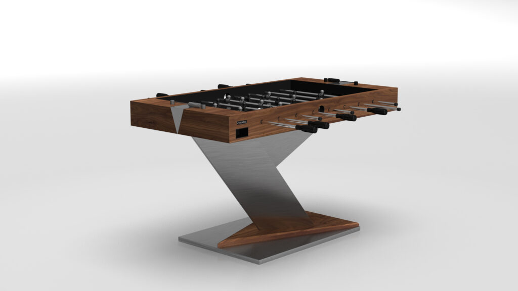 The Mitchell Foosball Table is a luxury game table featuring a sleek, angular design with a wooden top, metal handles, and a V-shaped metal base, all set against a plain white background.