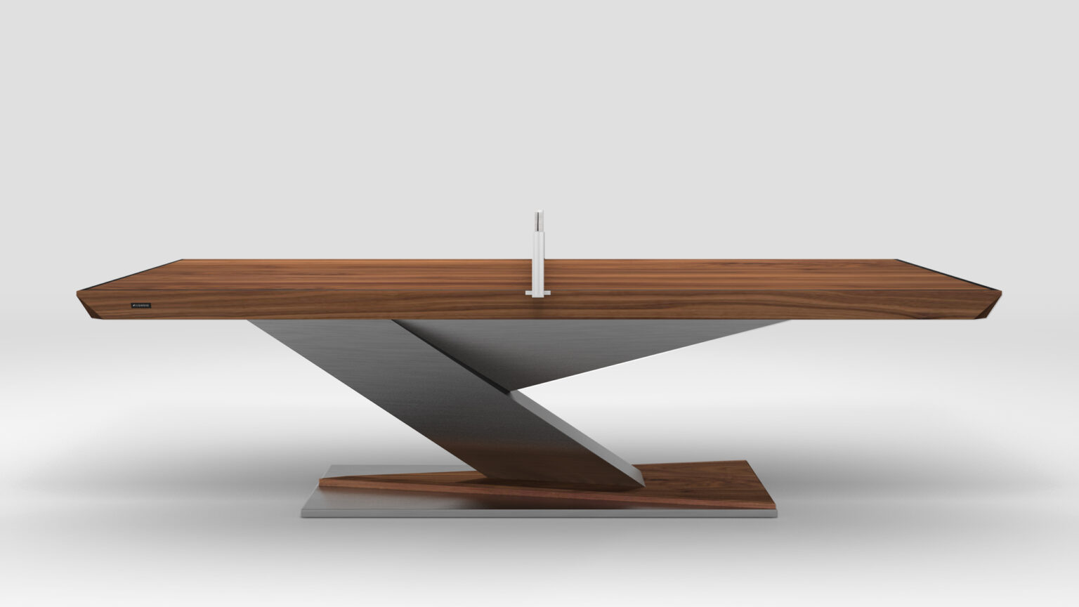 The Mitchell Ping Pong Table features a sleek, angular design with a wooden top and a zig-zag metal base, evoking luxury game tables. A small decorative object adorns its center, set against a plain light gray background.