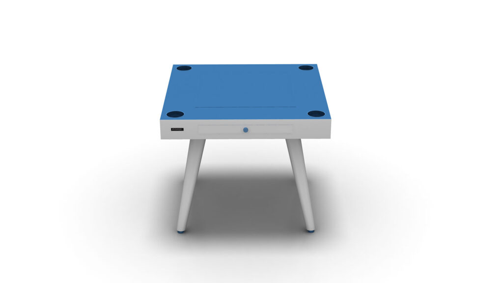 The Arclight Chess / Backgammon / Card Table is a luxury modern square table with a blue top, white legs, and four black corner pads. It includes a small drawer with a blue knob, ideal for minimalistic yet functional gaming against a plain backdrop.