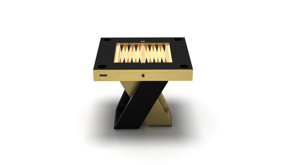 The Arclight Chess / Backgammon / Card Table is a luxury game table featuring a sleek black and gold design, geometric X-shaped base, and inlaid game board. Set against a white background, it adds elegance and sophistication to any space.