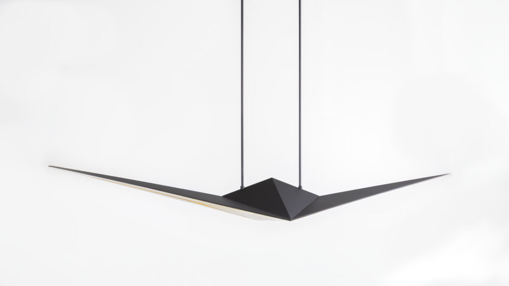 The Áves Pendant Light is a minimalist black pendant with a sleek, angular design and luxury game table-inspired elegance, featuring two long horizontal extensions suspended by two cords against a white background.