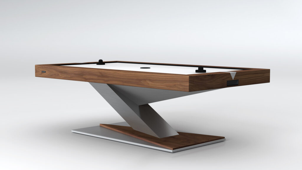 The Mitchell Air Hockey Table combines a modern luxury feel with a wooden frame and sleek metal base. It features a minimalist design, with a crisp white playing surface set against a clean, neutral background.