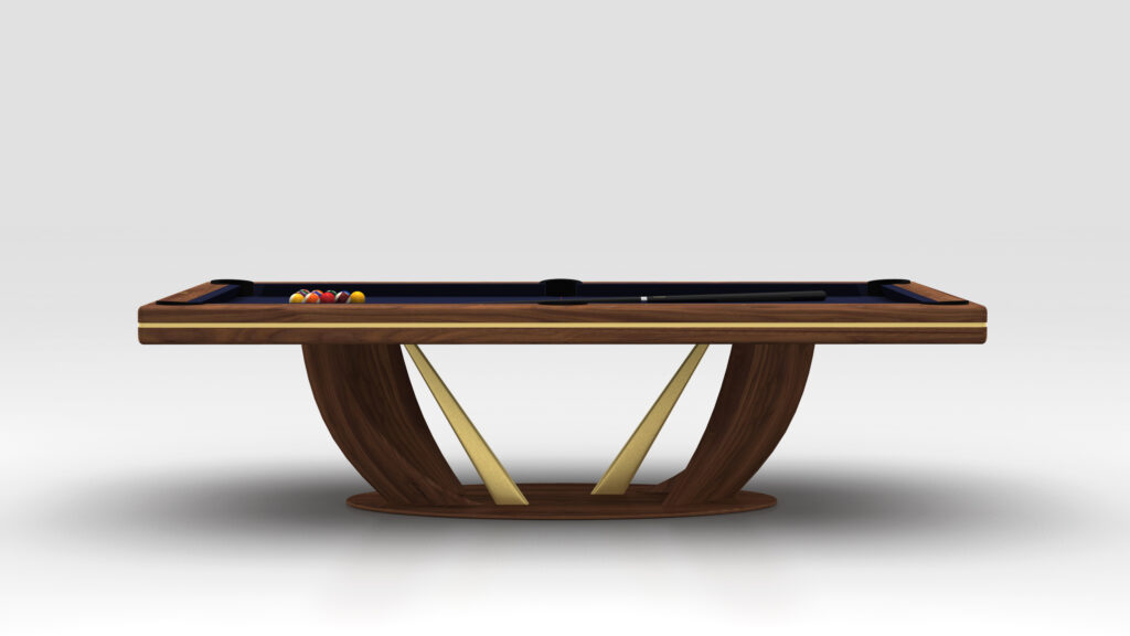 The Rubinacci Pool Table is a modern luxury game table with a sleek wooden finish and gold accents, showcasing a unique arched leg design. Pool balls and a cue rest on the dark felt surface, set against a neutral gray background.