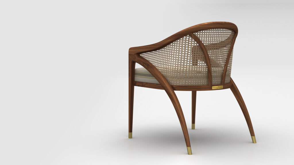 The Rubinacci Pool Table exudes luxury with its curved wooden features and woven cane detailing, complemented by slender, tapered legs with elegant metal caps. The sophisticated look is enhanced by a padded beige seat, set against a plain light gray background.