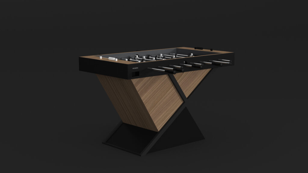 The Macan Foosball Table epitomizes luxury with its modern, geometric design. It features an angled wooden frame with dark accents, metal rods with foosball players, and a black playing surface, standing elegantly against a plain dark background.