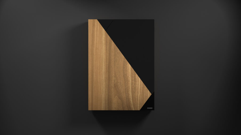 The Cardinal Dartboard - Quick Ship is a wall-mounted cabinet with a modern design featuring a diagonal split. The left section has a natural wood finish, contrasting elegantly with the sleek black right section against a dark backdrop for an elegant and simple look.