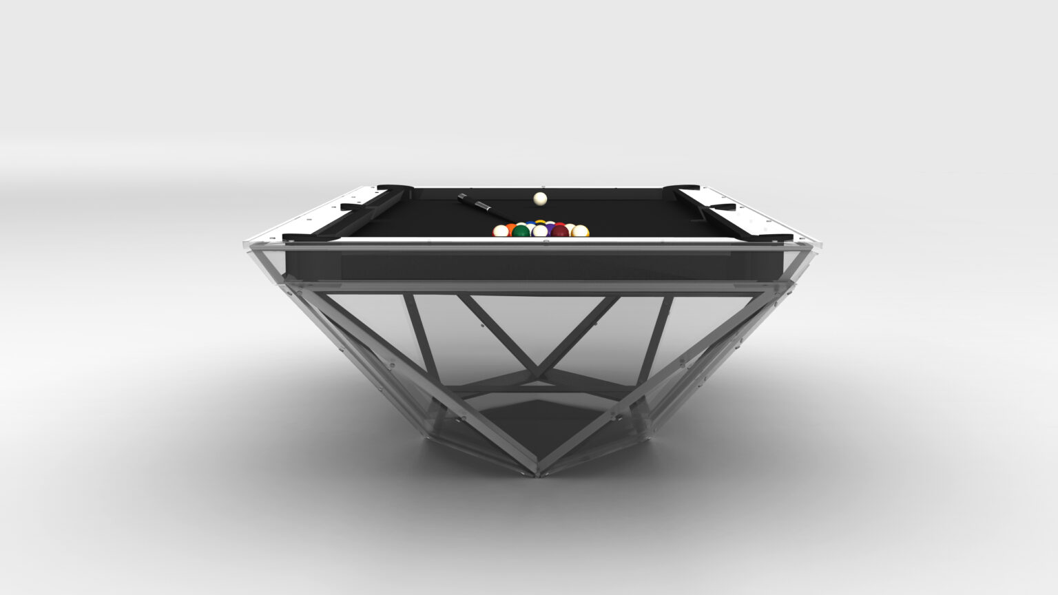 The Stealth Lucite Pool Table is a luxury game table featuring a transparent geometric base and sleek black surface. Vibrant balls adorn the table, set against a minimalist monochromatic backdrop that enhances its sophisticated allure.