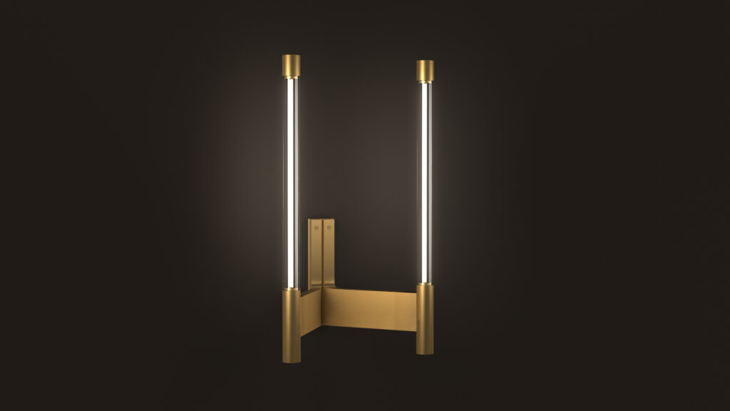 The Tré Sconce is a modern wall sconce with a sleek brass fixture featuring two vertical LED tubes, reminiscent of luxury game tables. It has a minimalist design with symmetrical, cylindrical metal ends enclosing the lights against a black background.