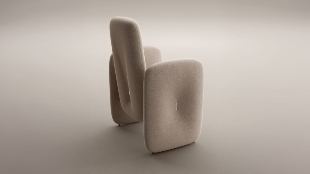 A sleek, beige upholstered armchair with rounded edges sits next to the Cena Dining Table, emphasizing its abstract geometric design against a simple light background.