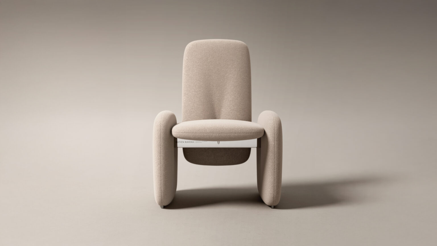 A modern beige armchair with rounded edges and three oval legs sits centered on a light gray background, styled next to the Cena Dining Table, with a white book placed under the seat.