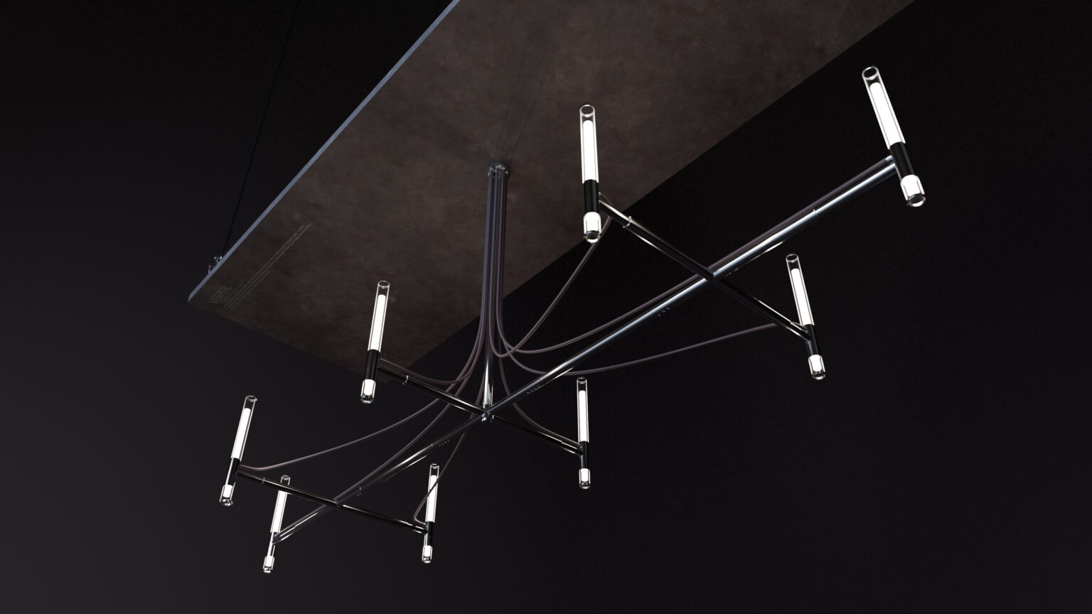 The Cena Dining Table sits beneath a modern chandelier with black metal arms and tubular LED lights, all set against a bold black background.