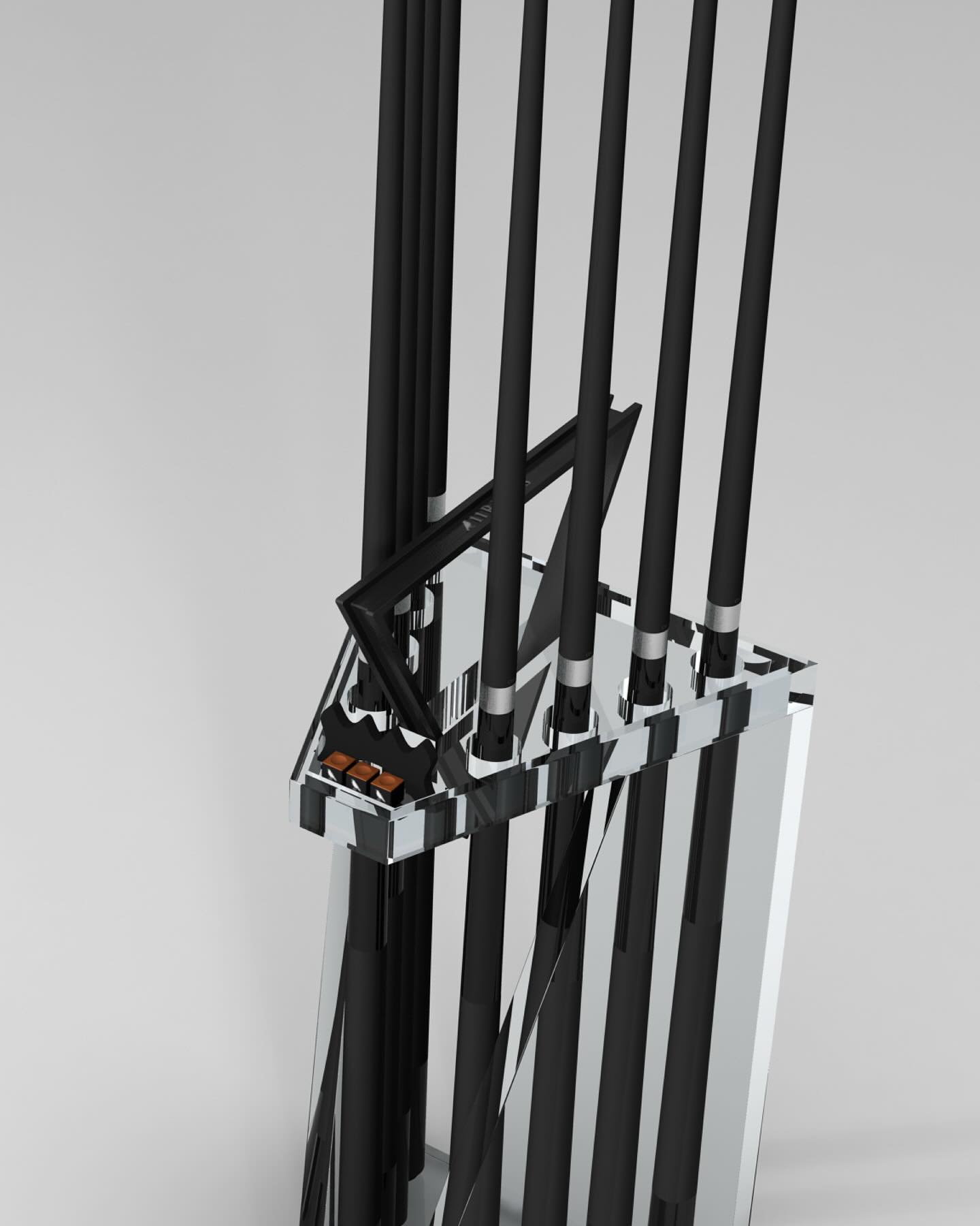 A modern, abstract sculpture features several tall, black rods arranged vertically in a reflective, angular metallic base against a light gray background. One rod is bent at an angle, and small brown shapes are visible inside the base.