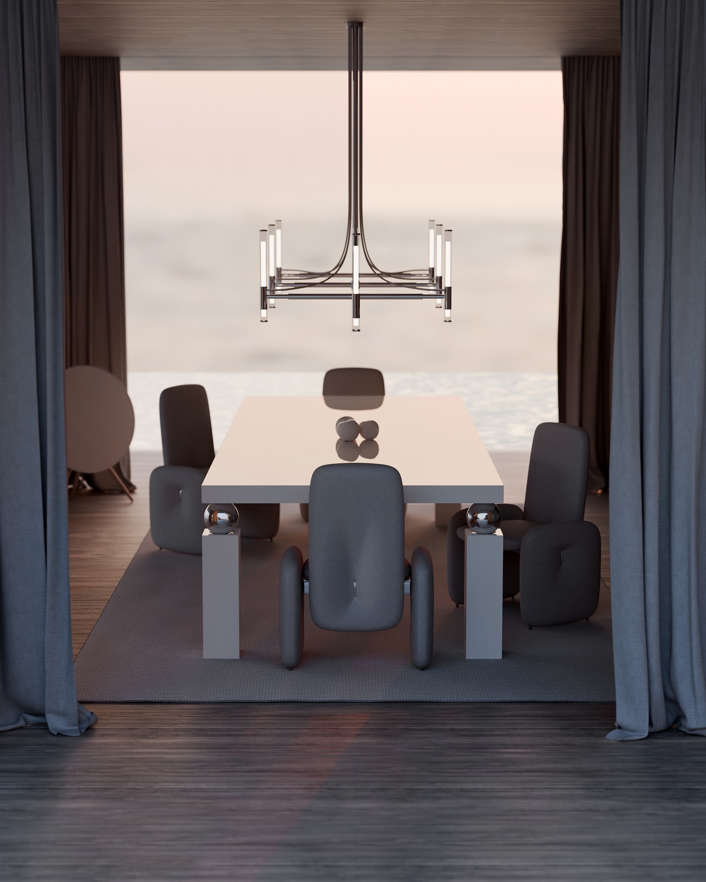 A modern dining room with a rectangular white table, six unique gray chairs, a minimalist chandelier, and large gray curtains framing an ocean view through open windows. The room has soft, natural lighting.