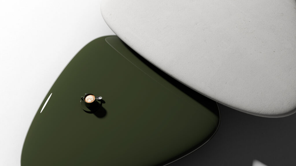 A small cup of coffee sits on a glossy, dark green, triangular table partially overlapped by a light gray, matte, triangular tabletop, both casting soft shadows on a white surface.