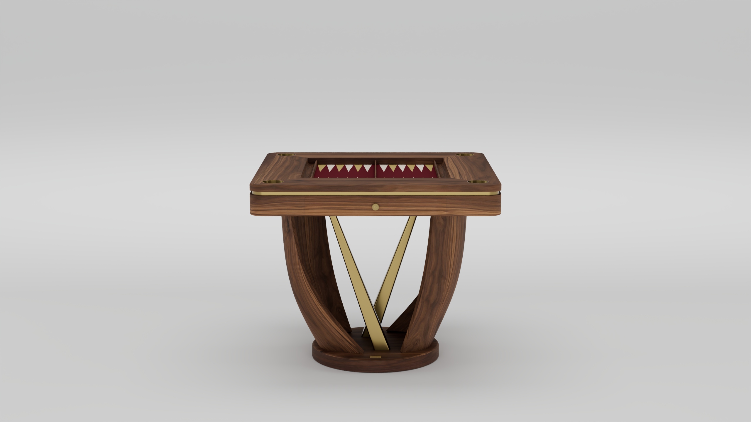 A modern handcrafted wooden table with brass accents, featuring a square top and geometric base. The tabletop has an inset area with red and white triangular patterns, resembling luxury game tables. The background is plain light gray.