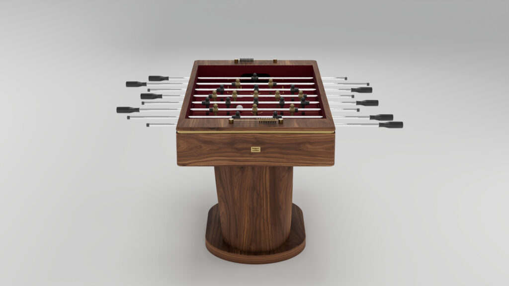 A modern luxury foosball table with a wooden finish, handcrafted details, metal rods, and black handles, standing on a single central pedestal base against a plain light background.