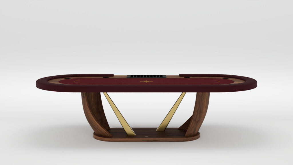 A modern luxury poker table with a maroon playing surface, gold accents, and a handcrafted wooden base featuring curved supports and two diagonal gold bars, set against a plain white background.
